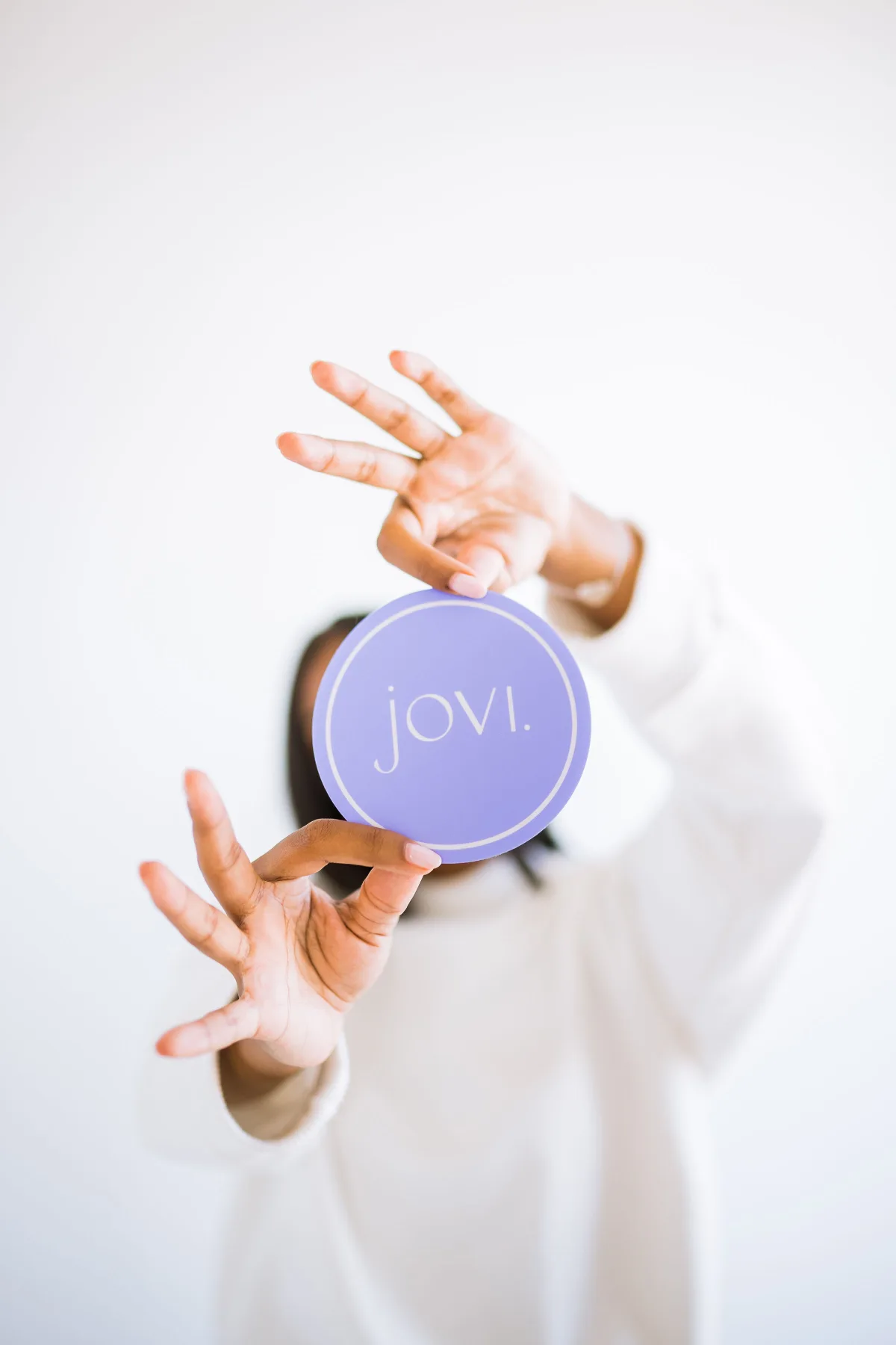Jovi coaster held to camera