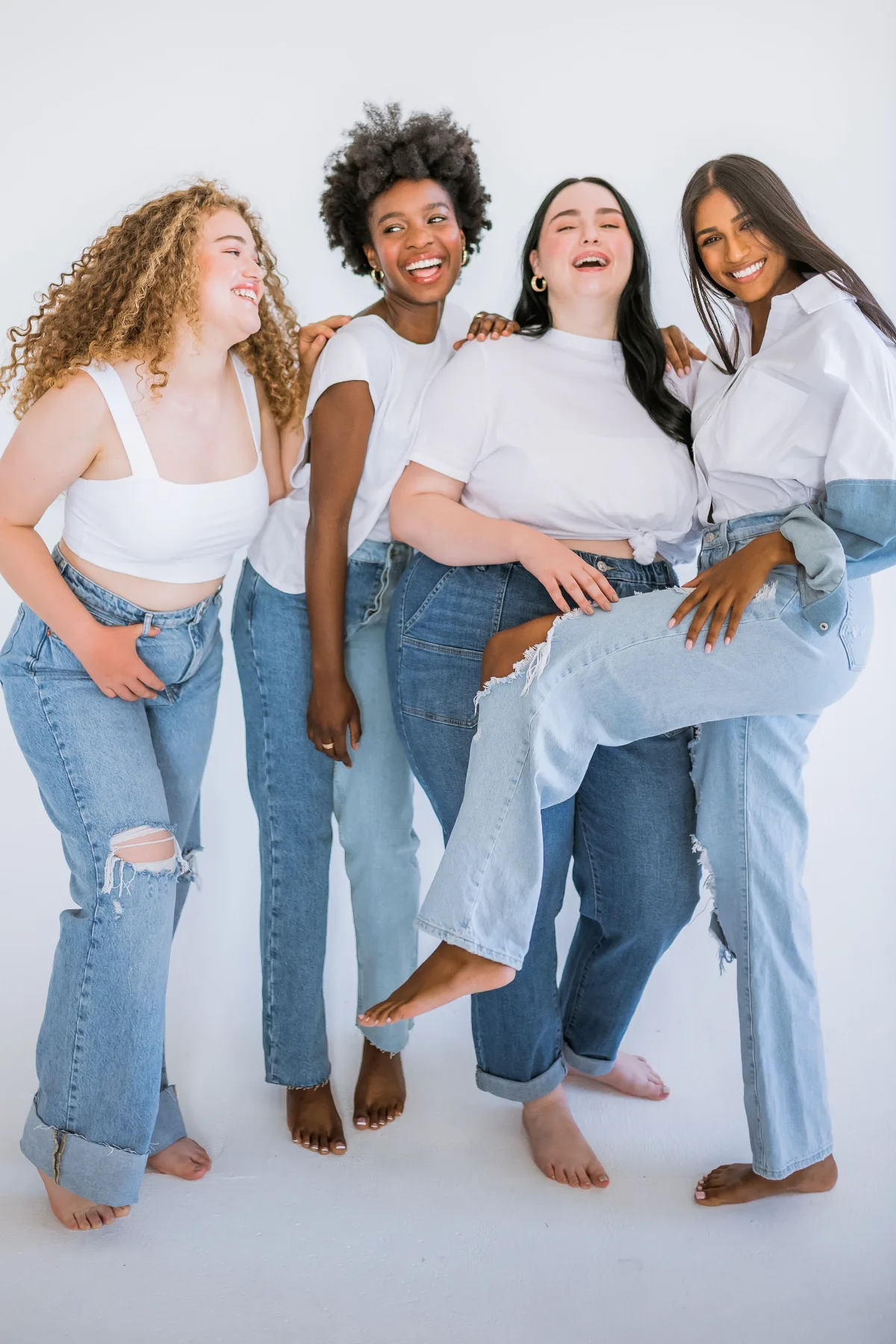 Four models in white and denim