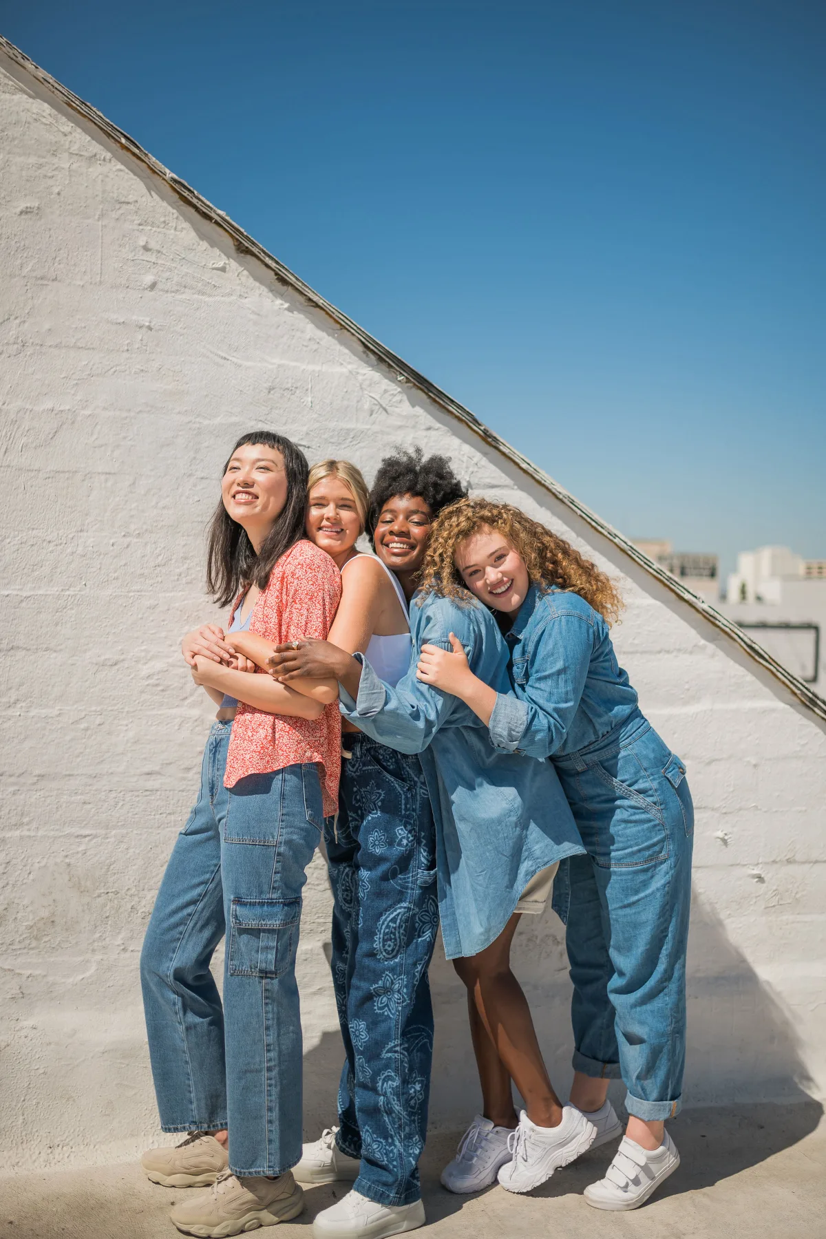 Four models on a rooftop