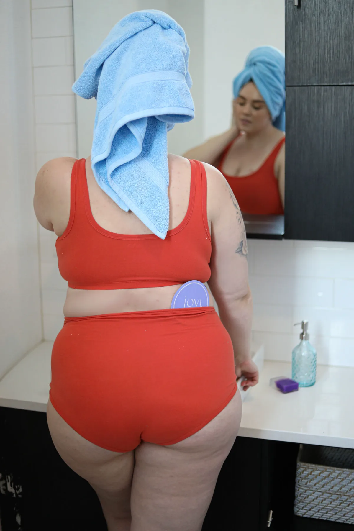 Model in red set with Jovi coaster