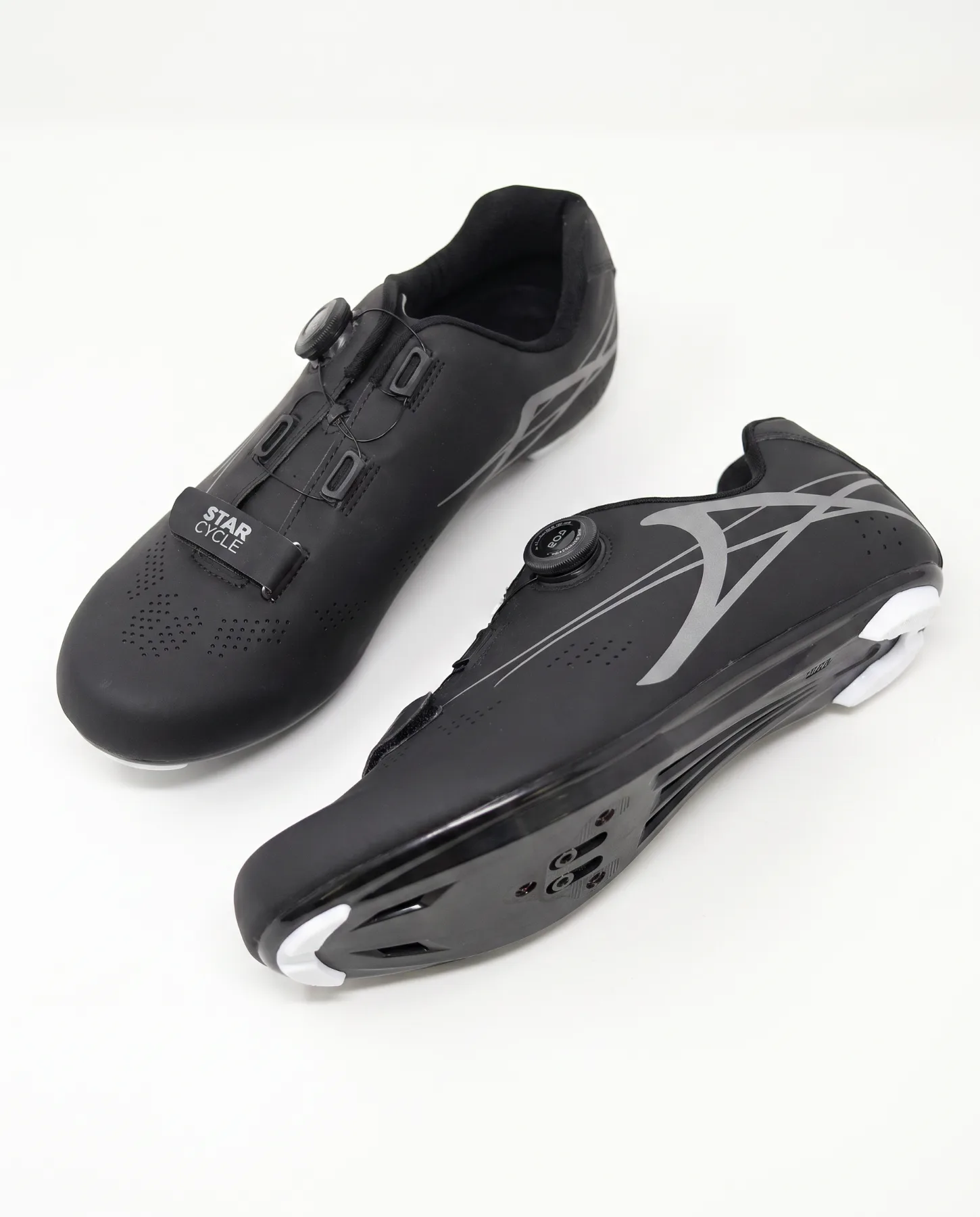 Spin shoes, black on concrete